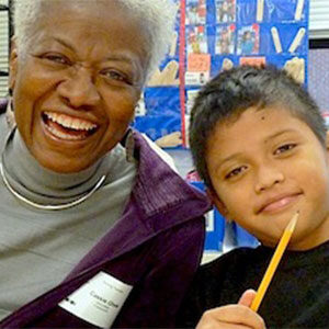 smiling volunteer and young boy